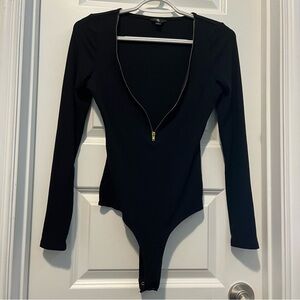 By guess is one piece bodysuit black long sleeves and the SZ small